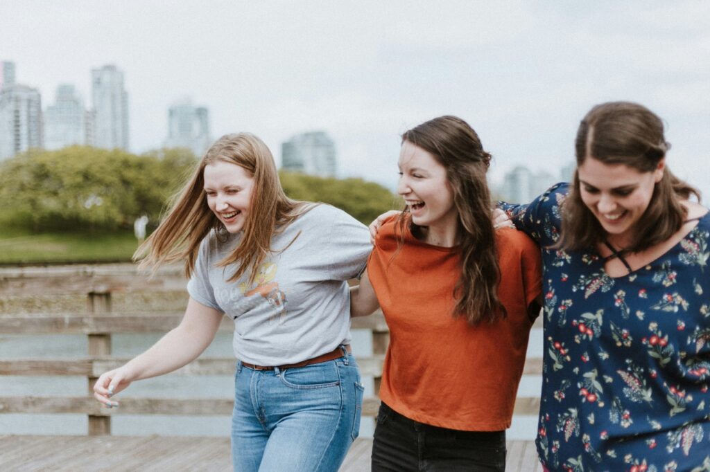 A group of 3 young women laughing